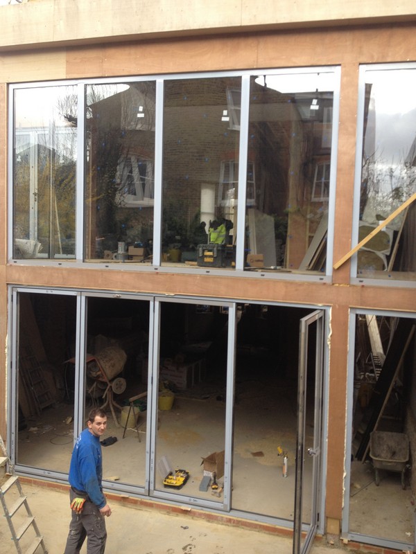 Aluminium bi-fold doors with two-storey glazing in Newbury